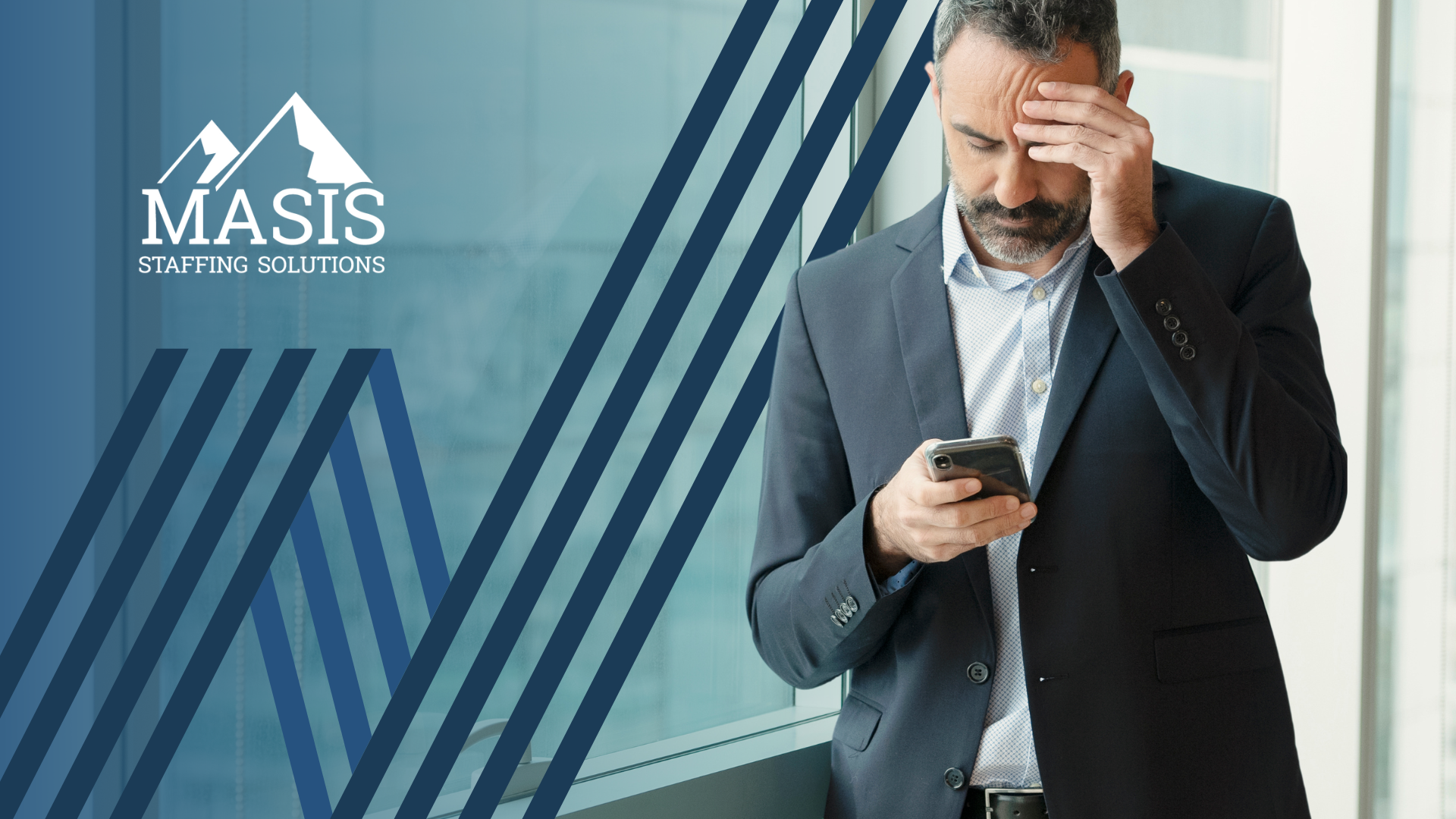 A man looking at his phone contemplating.