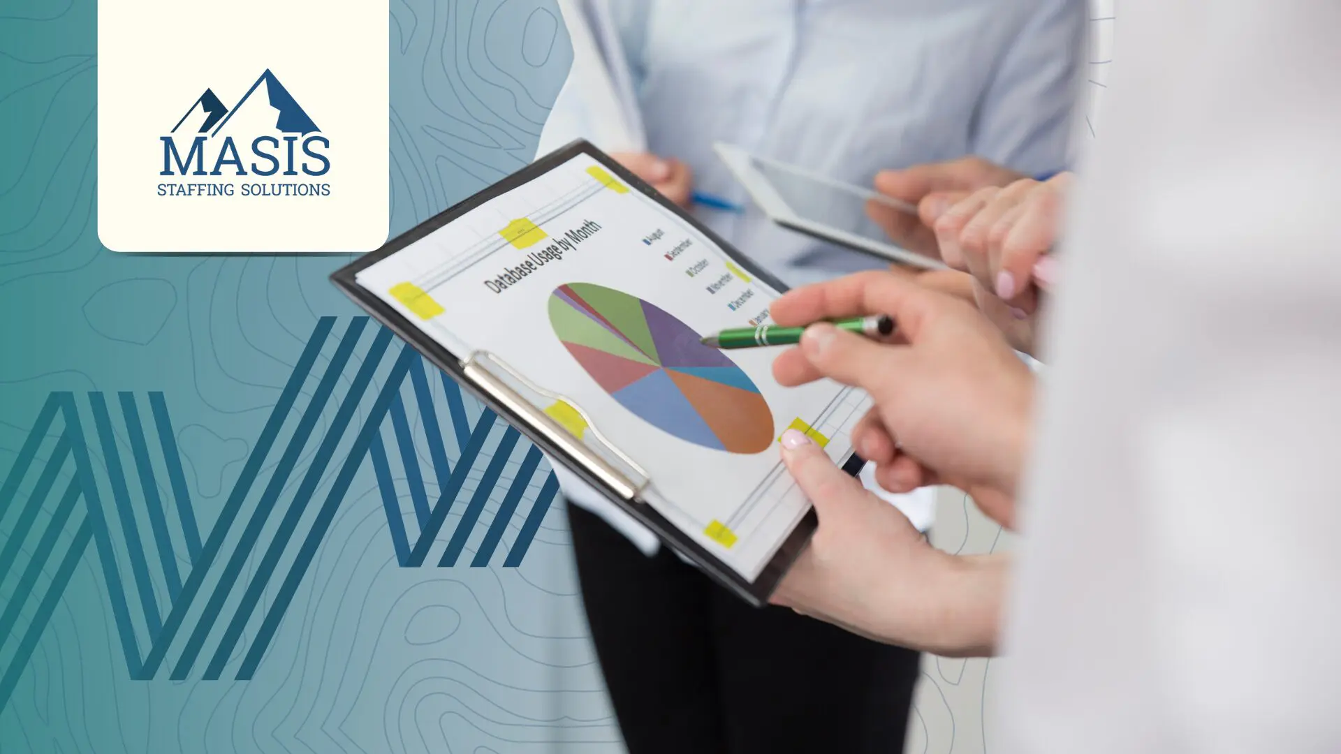 Employees viewing metrics on a tablet