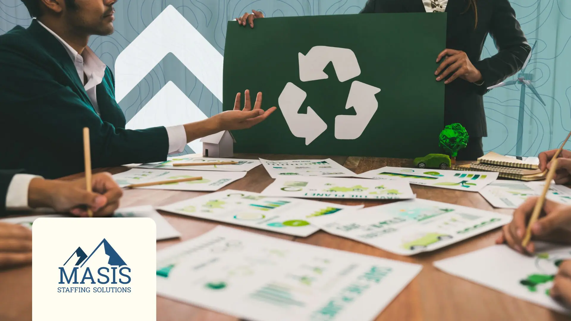 People discussing sustainable trends over a conference table full of papers and a recycle symbol being displayed