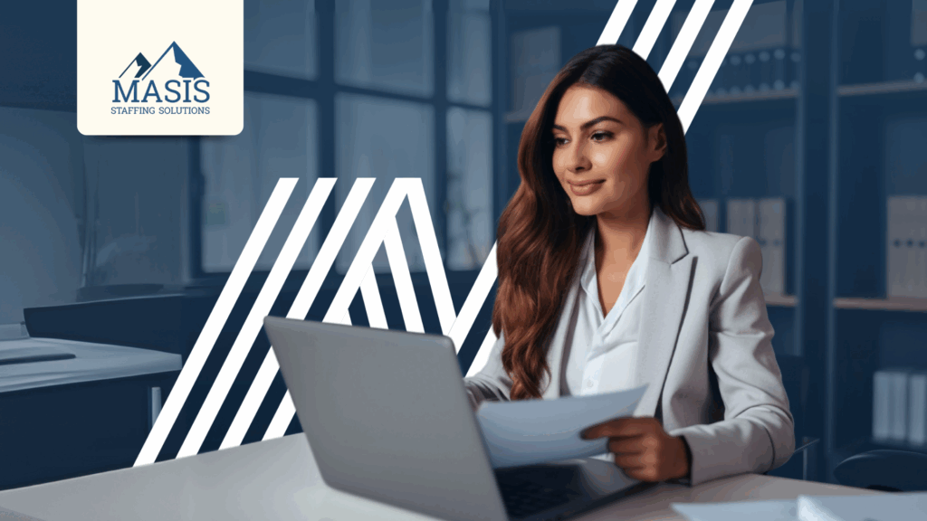 Employee works on laptop with a smile, illustrating how strategic hiring boosts employee engagement and work-life balance