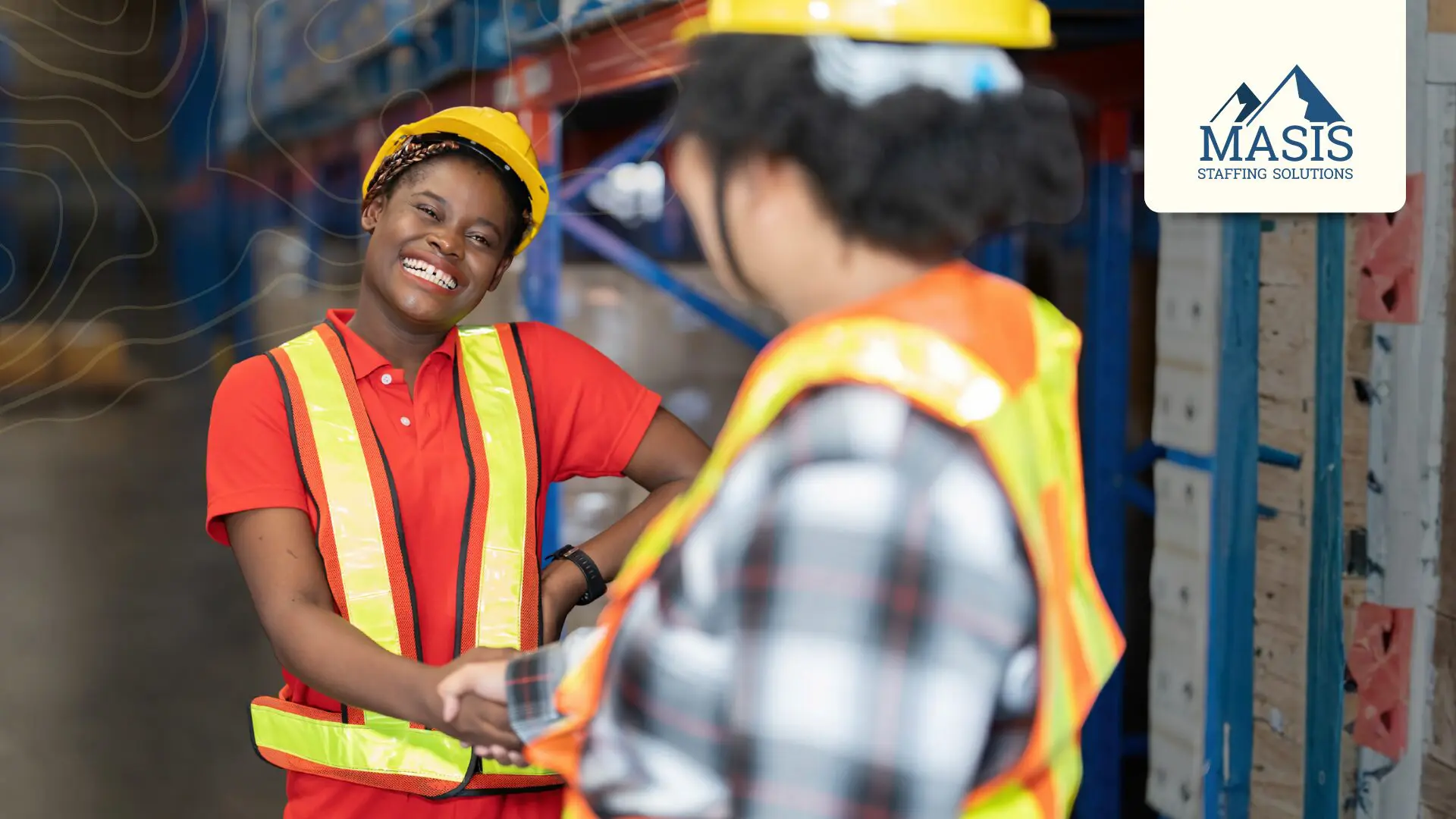 Smiling light industry worker wearing safety vest and hard hat shakes hands with onboarding staff