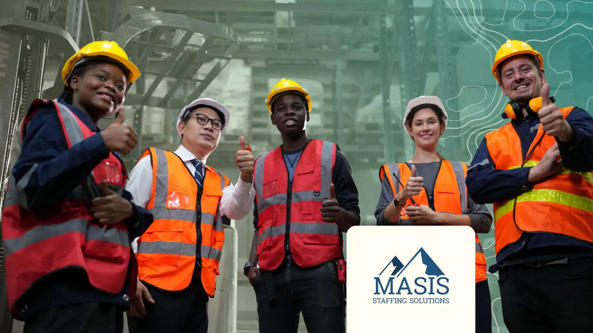 Warehouse workers stand smiling with thumbs up signs