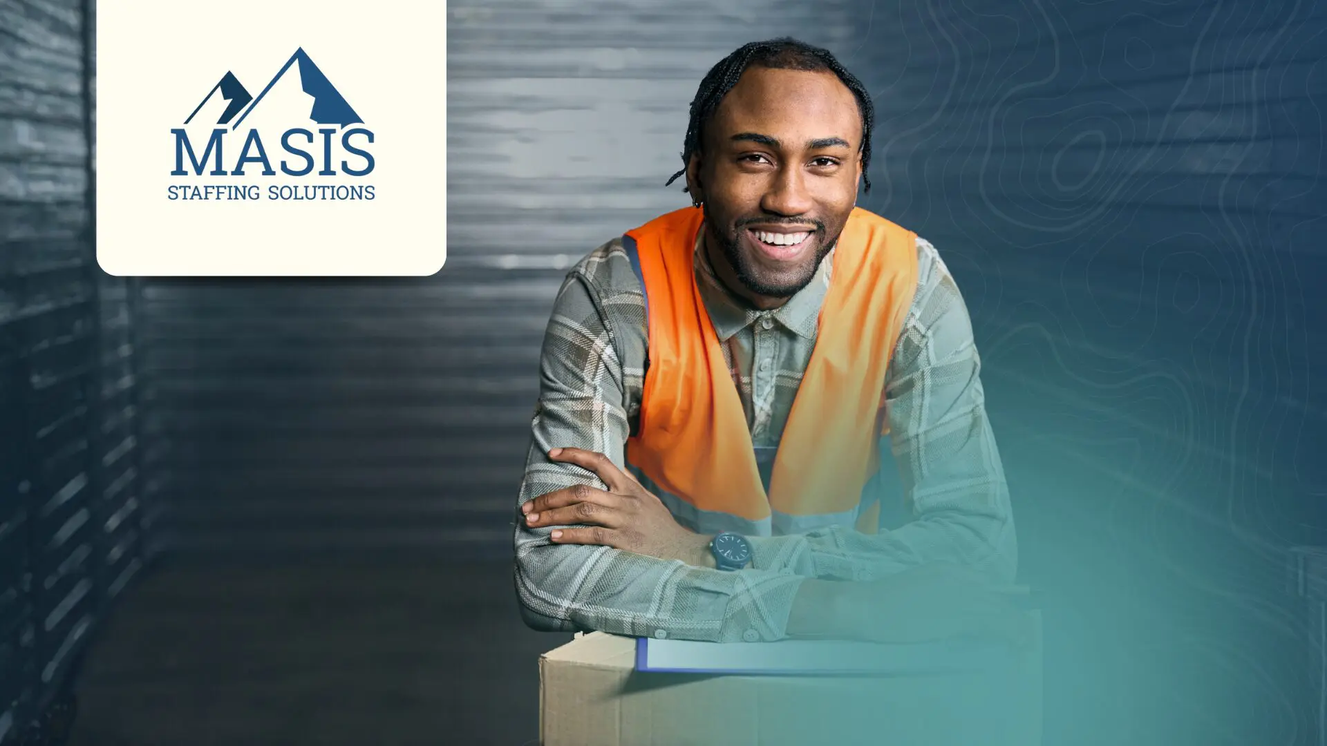Employee in logistics and distribution leans on a box with a clipboard, wearing a safety vest