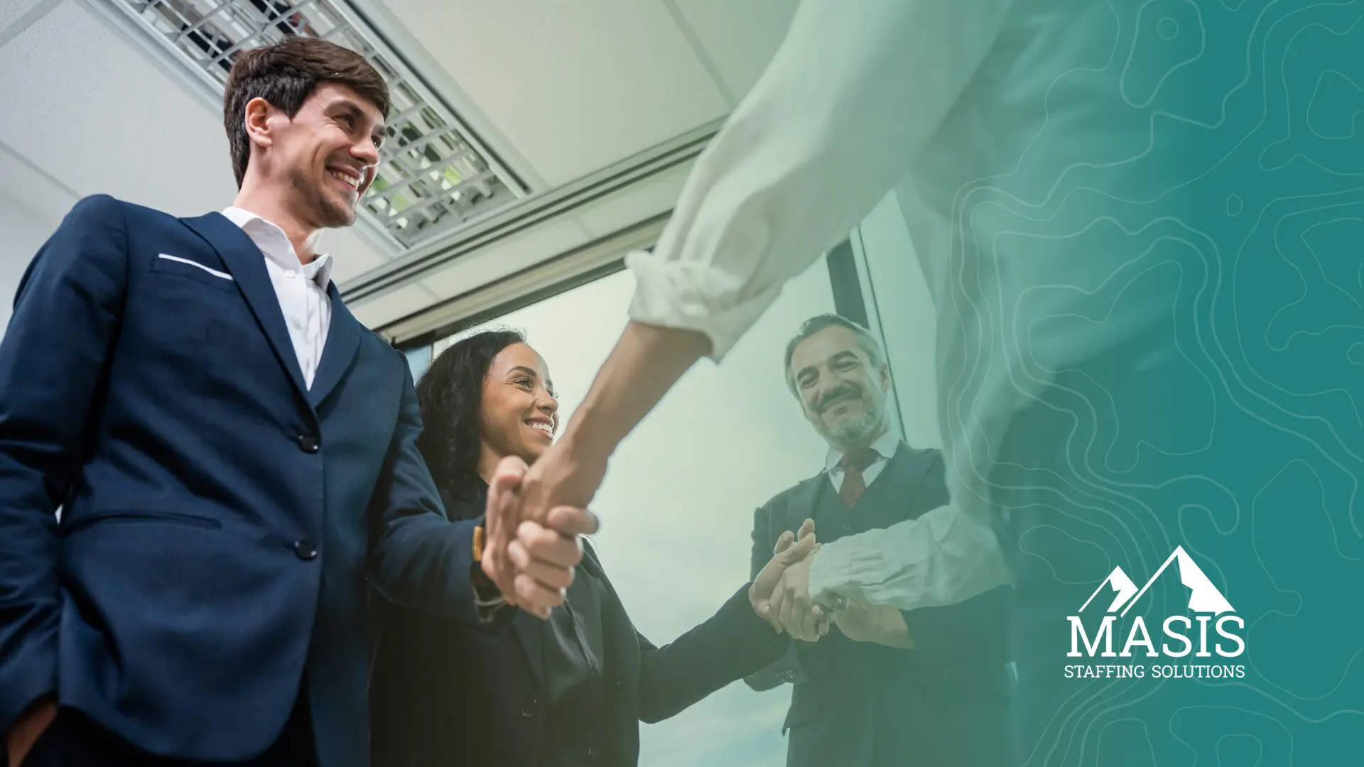A recruiter's new hires shake hands with their new employers