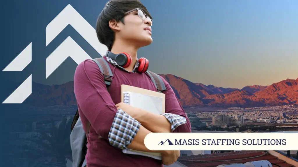 A fresh graduate wearing headphones and a backpack looks into the distance, symbolizing the first step in looking for entry-level position.