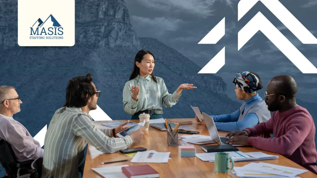 Professionals discuss candidate feedback and experience at a conference table