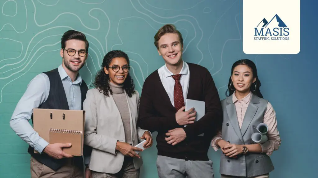 Early-career professionals stand in a row, smiling during their first 30 days.