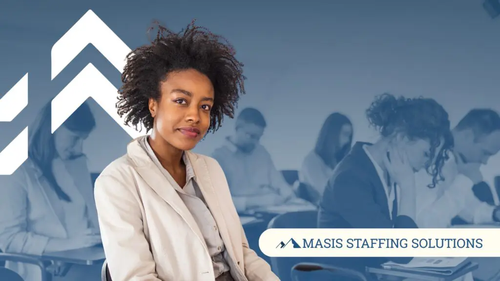 A contract worker smiles confidently against a background of professionals taking a written test.