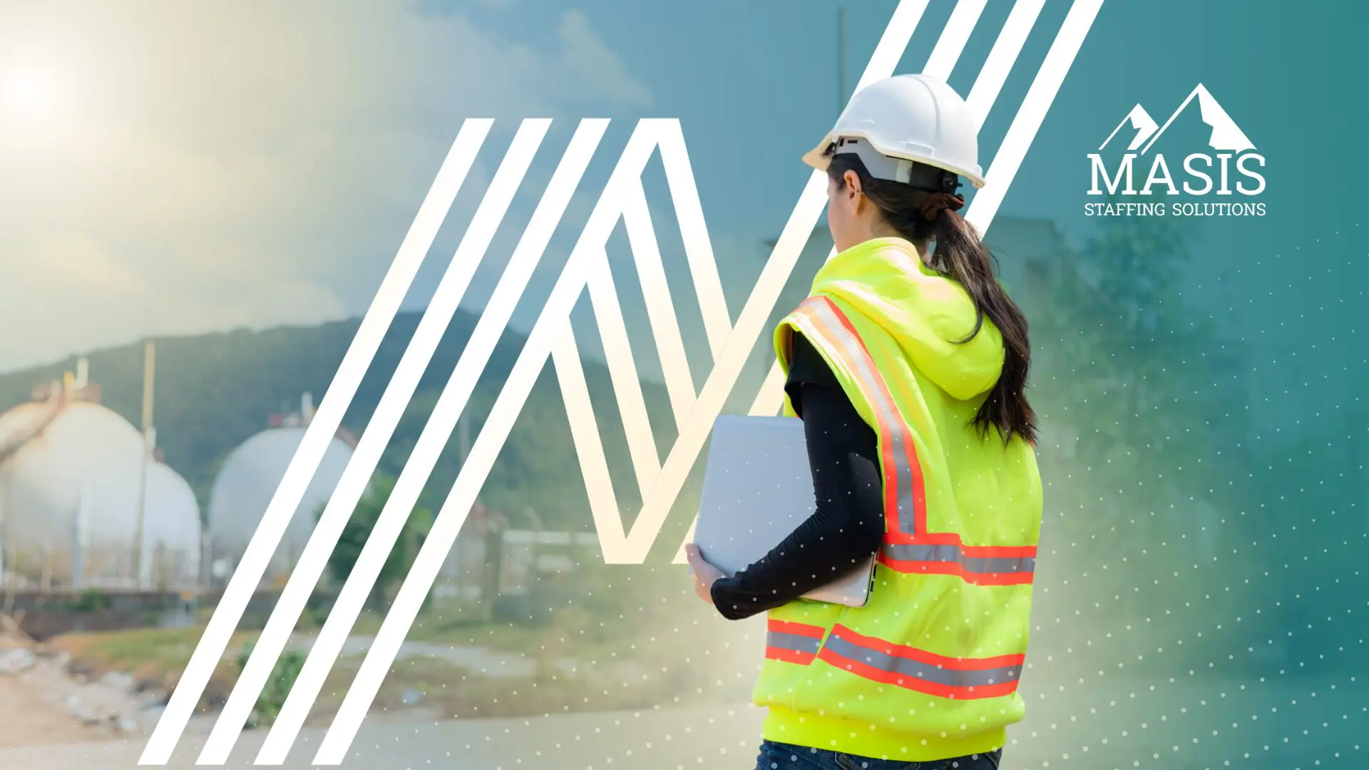 A worker in a hard hat and safety vest at an industrial facility, illustrating the skilled labor roles employers should be planning for ahead of Q4.