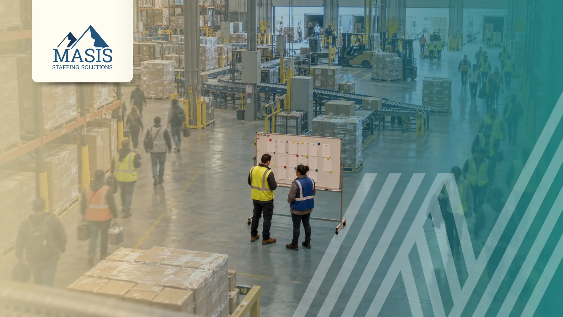 Two warehouse supervisors review a whiteboard on a busy warehouse floor as workers walk past. Masis Staffing Solutions logo.