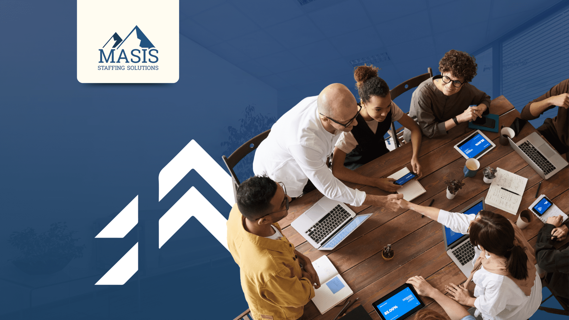 A planning team sits down at a conference table to discuss seasonal staffing strategies