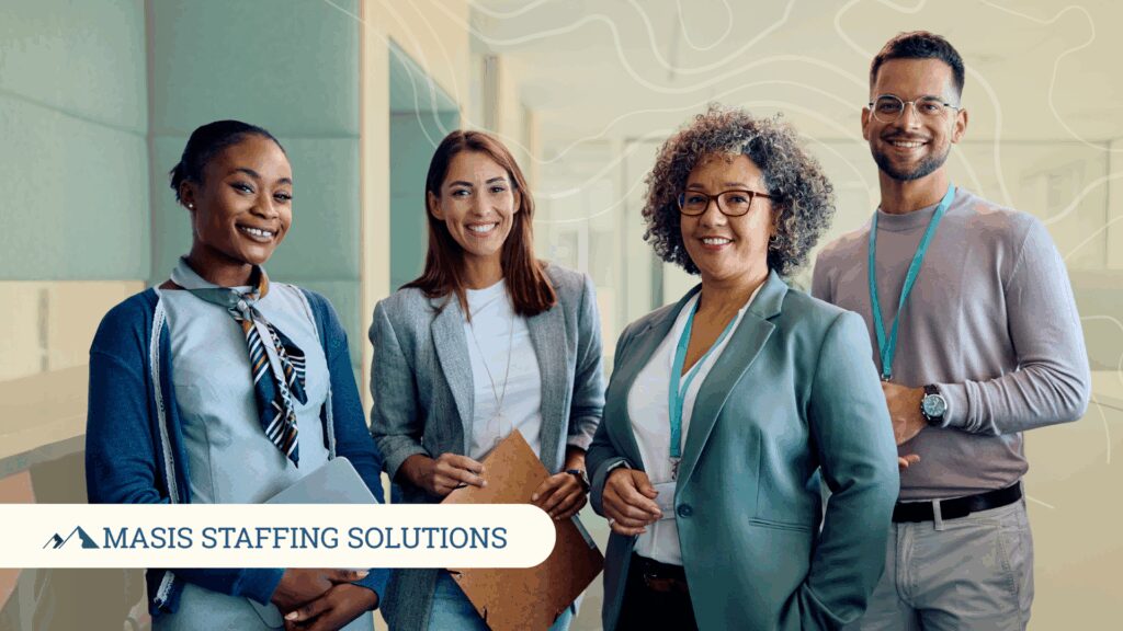 Hired employees stand smiling at the start of the year